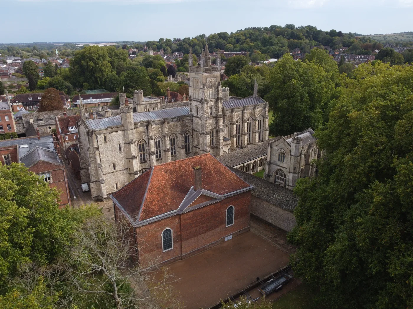 School, the college's red-brick schoolroom, in front of Winchester College Chapel