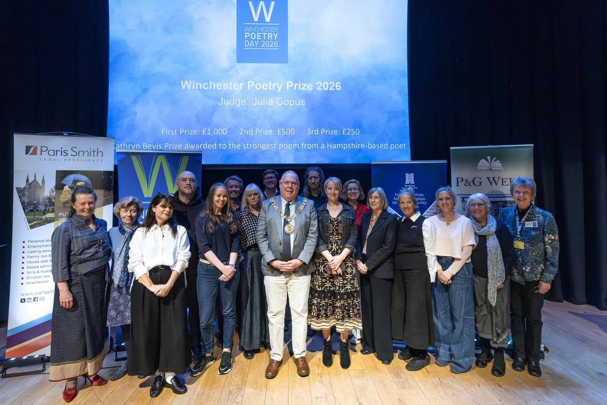 Winners, longlisted poets, the judge, the Mayor of Winchester and sponsors on stage at The ARC for the Winchester Poetry Prize 2026